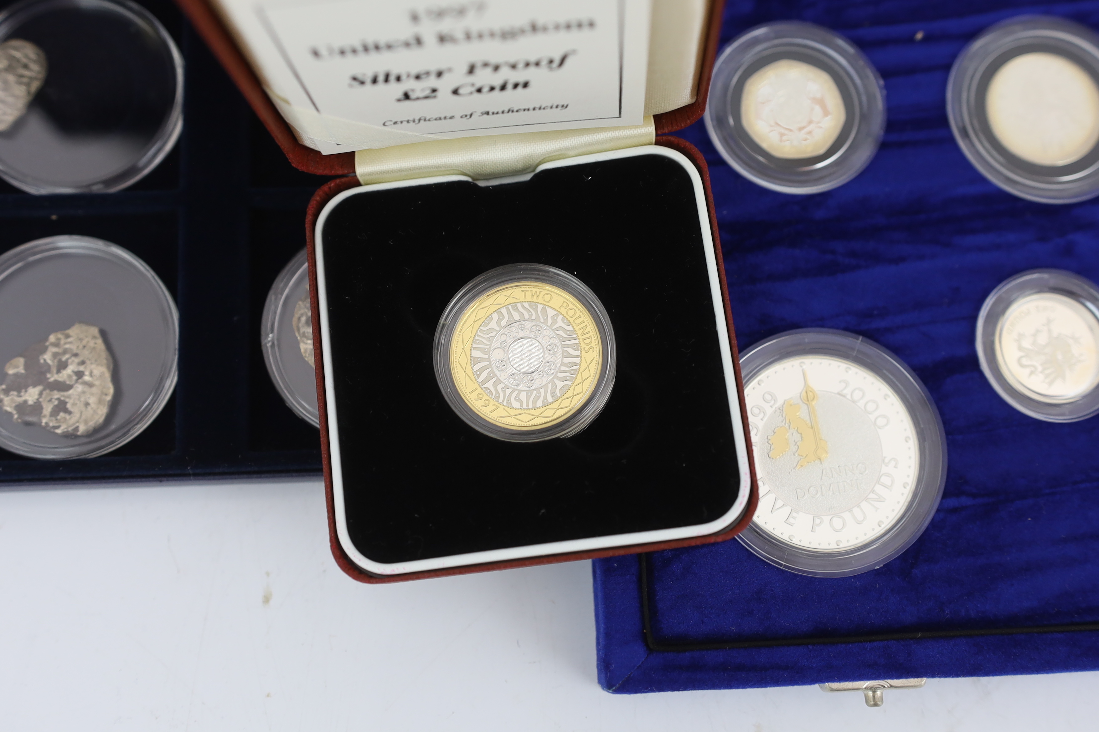 QEII Royal Mint proof coins – the United Kingdom millennium silver collection five pence to five pounds with Maundy 1p to 4p , two millennium silver proof crowns and a 1997 silver proof two pound coin, together with West